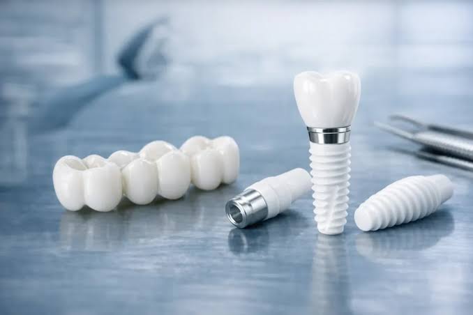 Zirconia dental crown components and bridge on metallic surface
